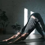 a men doing downward-facing dog yoga asana
