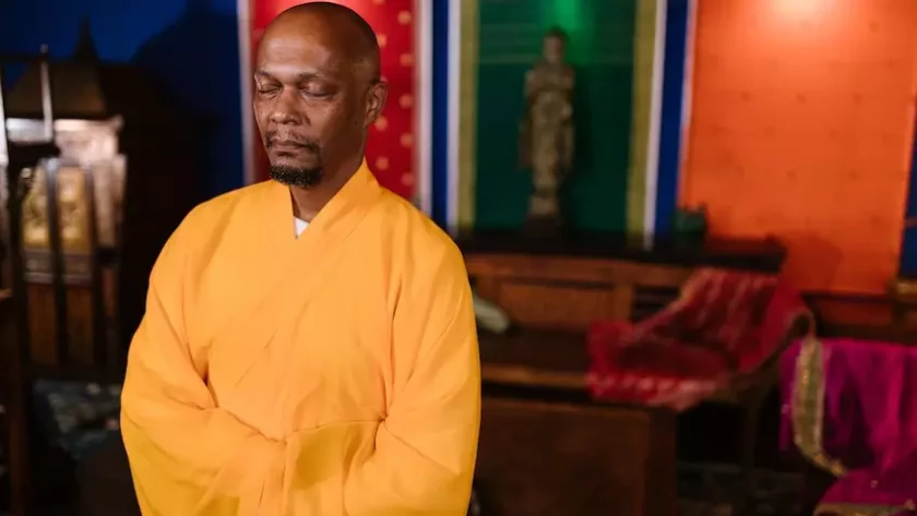 a monk doing meditation while standing
