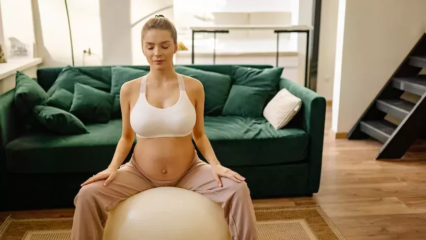 Women doing exercise ball during pregnancy