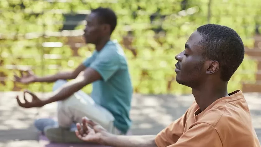two men sitting in meditation