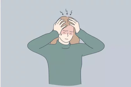 A girl is holding her head because of headache