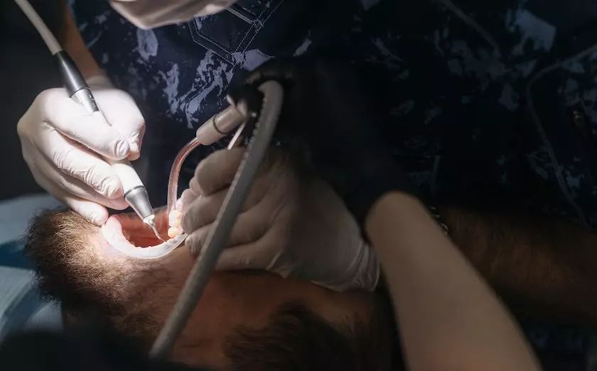 a dental surgeon doing teeth treatment