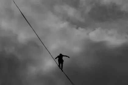 a person is walking on rope