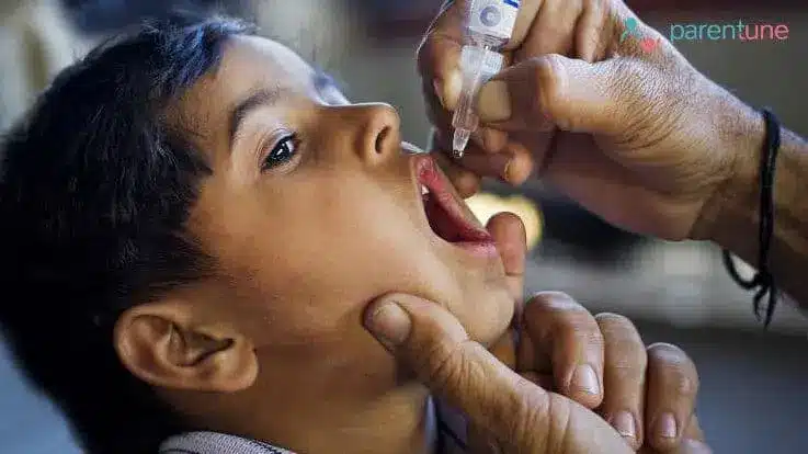 an Indian child receiving a polio drops
