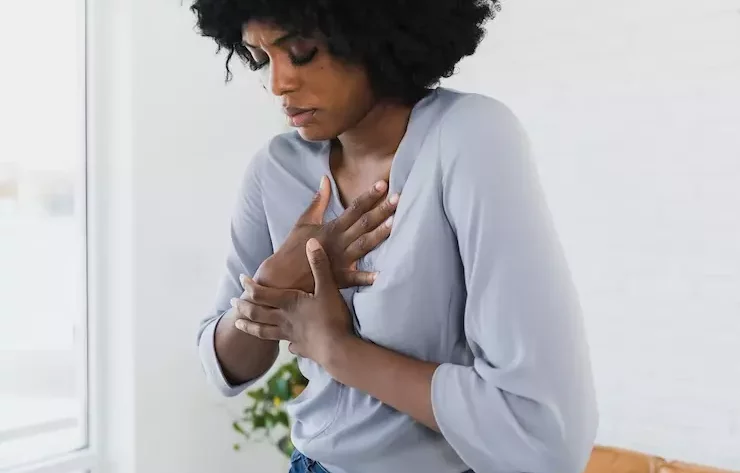 A woman having a chest pain due to a heart attack