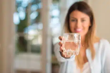 A woman going to drink water in the morning on an empty stomach