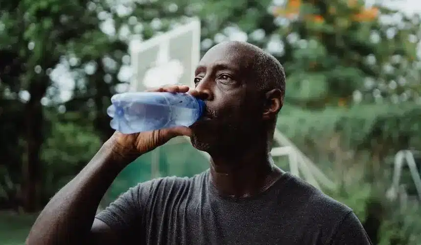 a man drinking water