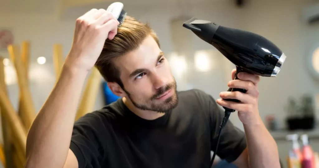 A men use hair dryer