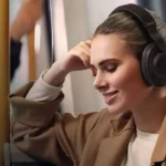 A gril wearing a headphone and listening music