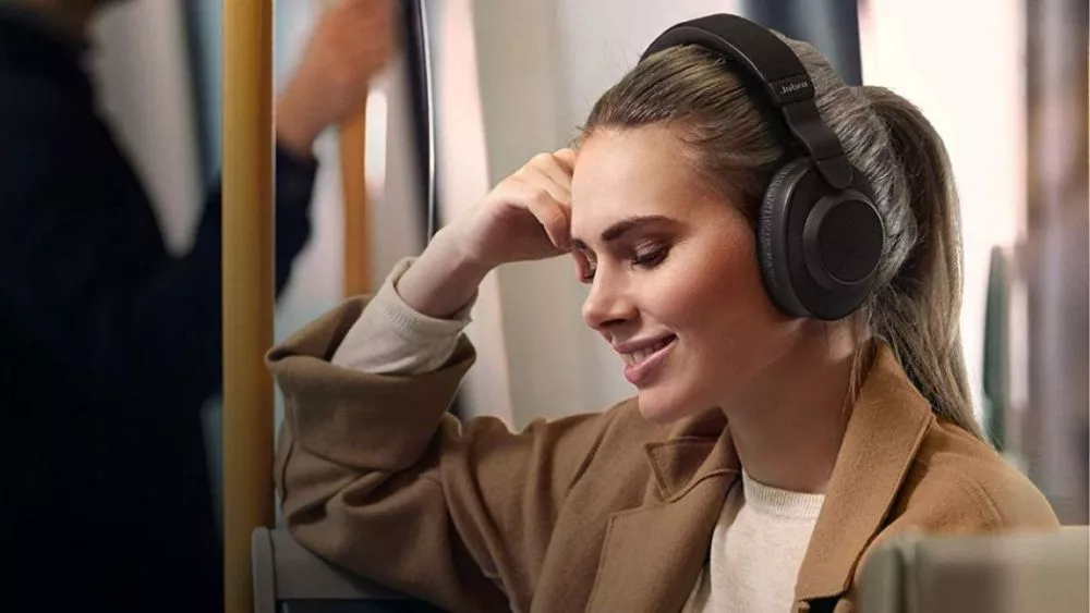 A gril wearing a headphone and listening music