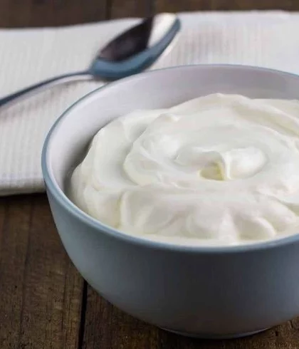 A bowl of yogurt with a spoon