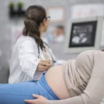 A doctor checking a Pregnant lady
