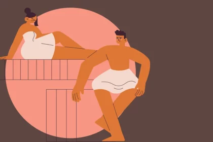 a man and woman are sitting in a sauna