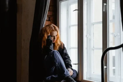 A women sit side of the window