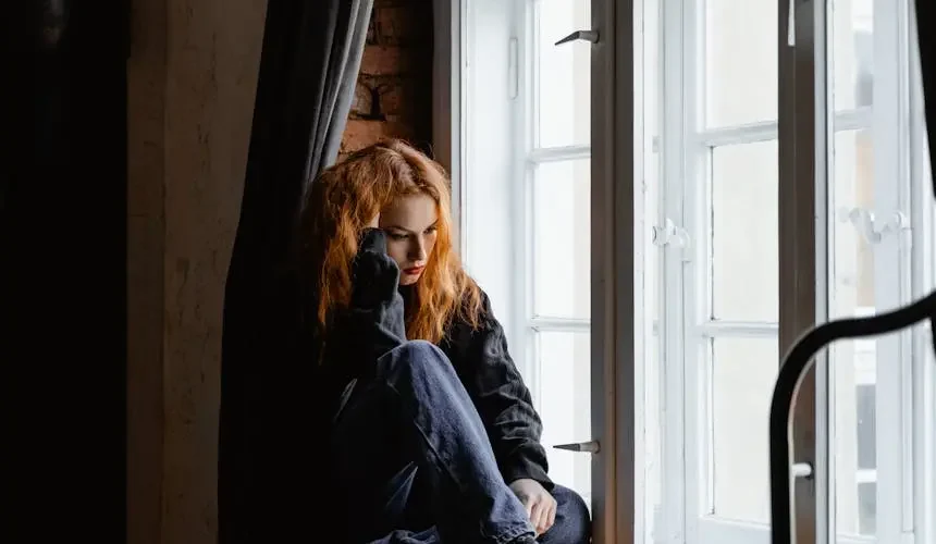 A women sit side of the window